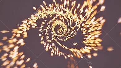 Golden firework exploding in a spiral shape with a motion blur effect, creating a sense of energy and excitement against a dark