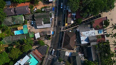 25.1.25 koh chang tha, cars on village road. Dramatic aerial view flight drone