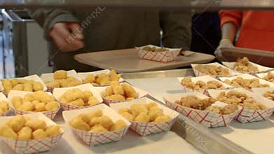 High school student in cafeteria with fried food