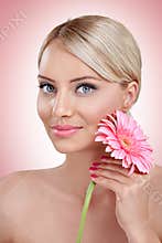 Tender woman with pink flower