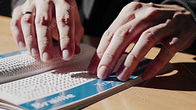 AI Hands read braille travel guide