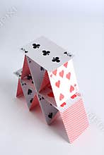 House of playing cards on white background