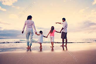 Happy Family have Fun Walking on Beach at Sunset