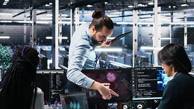 Data center manager coordinates programmers fixing critical error while using AI