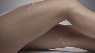 A woman's bare nude legs
