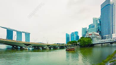 Pleasure boat in the river near bridges. Singapore
