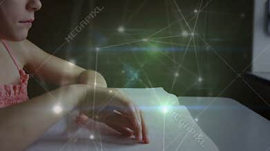 Child gliding fingertips on Braille book and activating digital network around hands for learning