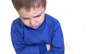 The face of an offended boy with a look from under his brow. resentment, grief. Unhappy childhood.