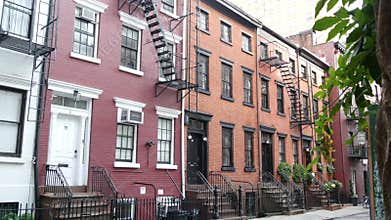 New York City building architecture. Urban residential house exterior. Real estate. Red brick facade