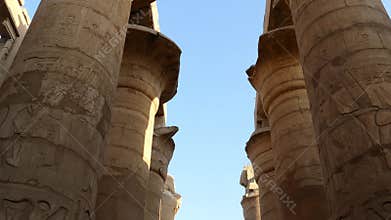columns in karnak temple with ancient egypt hieroglyphics - tilt view 4k