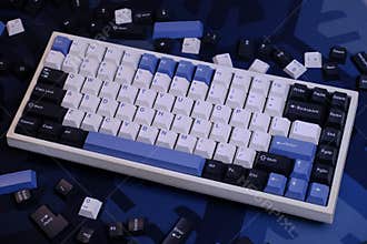Modern 75% Layout White Mechanical Keyboard With Minimalist Theme of White, Blue, and Black Keycaps on a Minimal Blue Deskmat