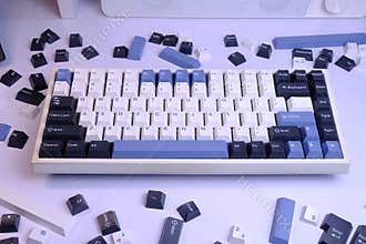 Modern 75% Layout Mechanical Keyboard with White, Blue, and Black Keycaps on a Clean White Desk