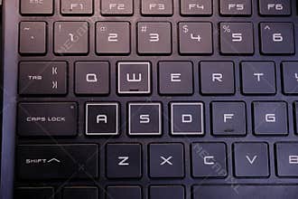 Closeup Black and White Laptop Keyboard With Modern Gaming Accent