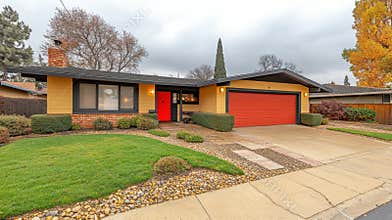 Ranch Style Home with Yellow Walls and Red Accents