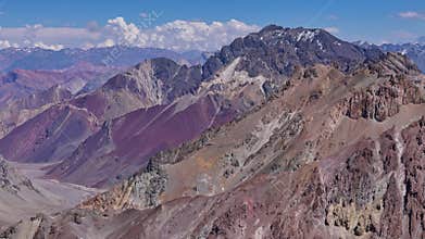 Snow-covered peaks and steep cliffs in the Andes, Argentina