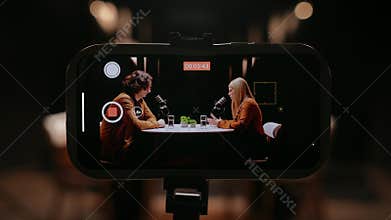 Engaging Discussion Between Media Influencers in a Dynamic Recording Studio