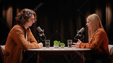 Engaging Discussion Between Influencers in a Modern Podcast Studio Setting