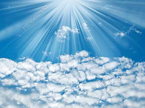 Blue sky with sun rays and clouds