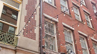 New York City Manhattan building architecture. Red brick house exterior. Real estate property, USA.