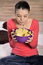Beautiful woman eating junk food
