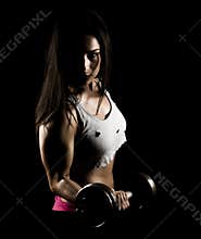 Strong fitness woman working out with heavy weights
