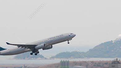 Airbus A330 of Cathay Pacific flying away