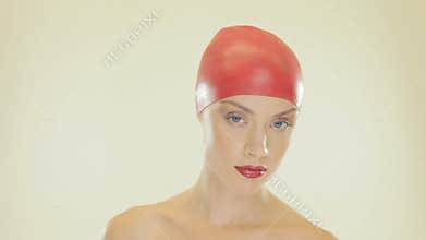 Blonde woman removing her swimming cap