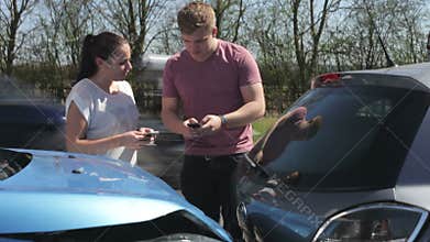 Two Drivers Exchange Insurance Details After Accident
