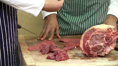 Butcher Teaching Apprentice How To Prepare Meat