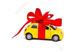 A gift. Car with a red bow