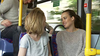 Two Young Women On Bus Journey Together