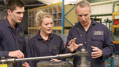 Engineer Teaching Apprentices To Use Tube Bending Machine