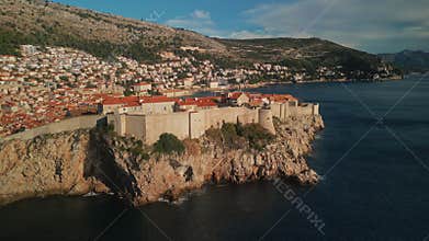Impregnable medieval fort Lovrijenac and town on high cliff over calm sea