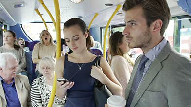 Passengers Standing On Busy Commuter Bus