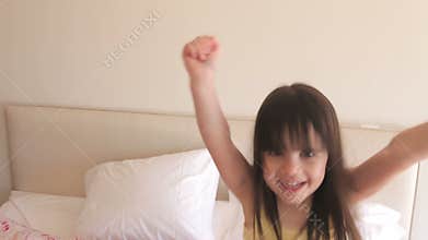 Young girl runs into bedroom