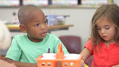 Group Of Elementary Age Children In Art Class