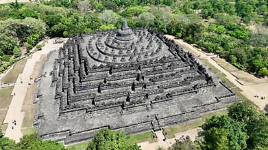 Borobudur symmetrical beauty is revealed from above, showcasing its intricate terraces and serene central stupa. This UNESCO World