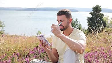 Author writing around inspiring nature