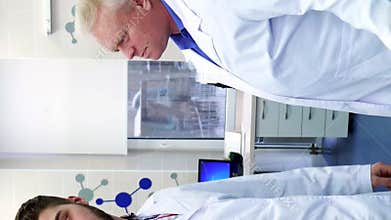 Two male scientists warmly greet each other in a modern laboratory
