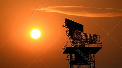 Silhouette radar communication tower and plane