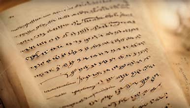 Animated zoom-in on a blank textbook page as flowing cursive writing gradually appears,