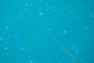 Night sky filled with sparkling stars against a turquoise background creates a serene and mystical atmosphere