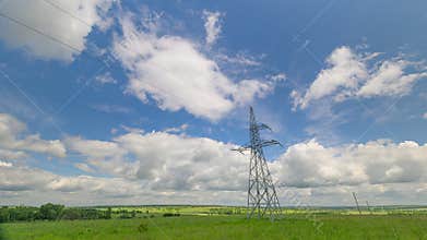 Electric high voltage pylon against sky. Transmission Towers on the Background of beautiful cloudy sky. Electricity Pylons and