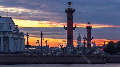 Sunset over Strelka - Spit of Vasilyevsky Island with Rostral Columns timelapse in Saint Petersburg, Russia
