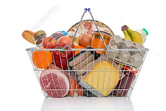 Shopping basket full of groceries isolated