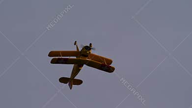 Bucker Bu 133 Jungmeister RC model performs a slow roll maneuver