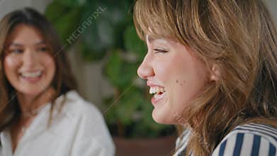 Group friendly women talking smiling at home gathering closeup. Happy friends