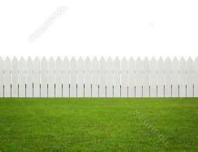Front or back yard, white wooden fence on the grass isolated on