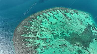 Blue Sea with A huge underwater reef. Aerial View Looking Straight Down. Tropical Barrier Reef