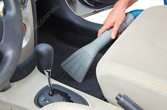 Vacuuming a car interior automobile detailing